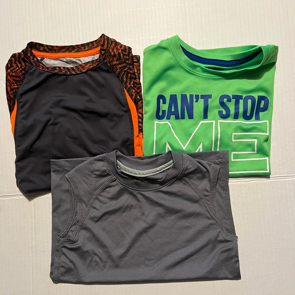 Three boys dry fit shirts.